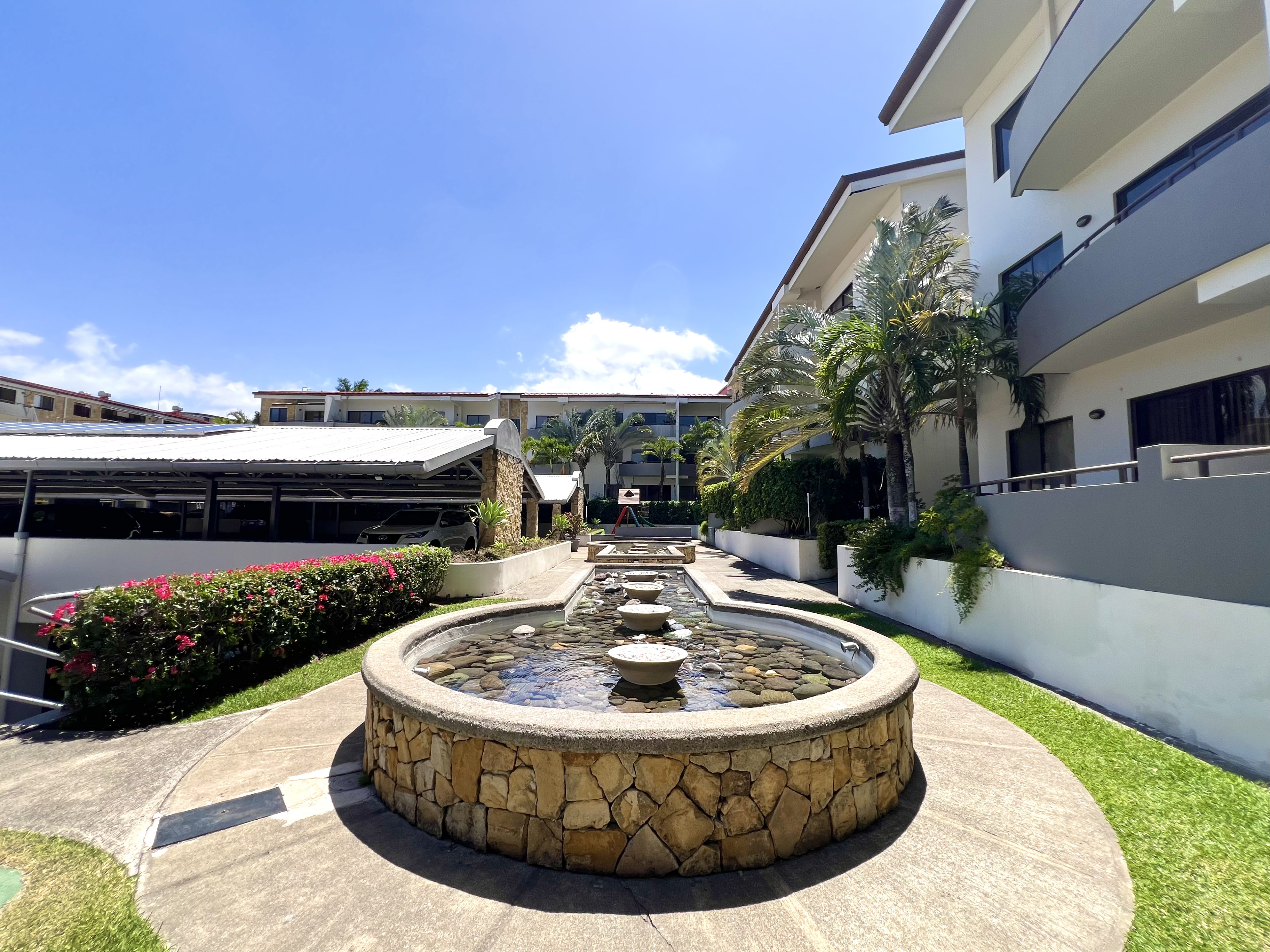 Gardens and fountain at Avalon Condominium